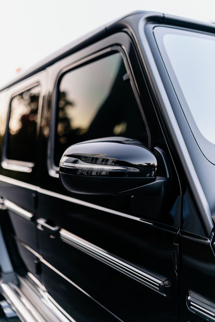 Elegant side view of a luxury black SUV highlighting its sleek design and sophistication.